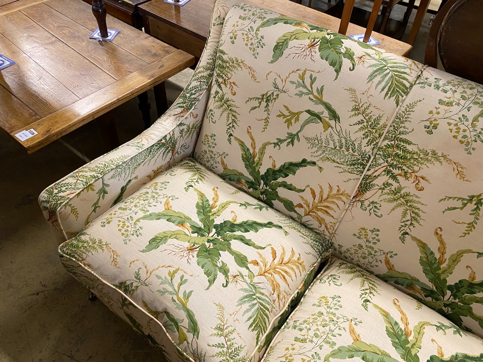 A “Highly Sprung Ltd” Colefax and Fowler fabric three seater sofa with feather cushion seats, width 210, depth 86cm, height 90cm.